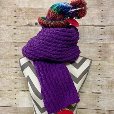 Fiber Arts Club 2025 hat and scarf on mannequin