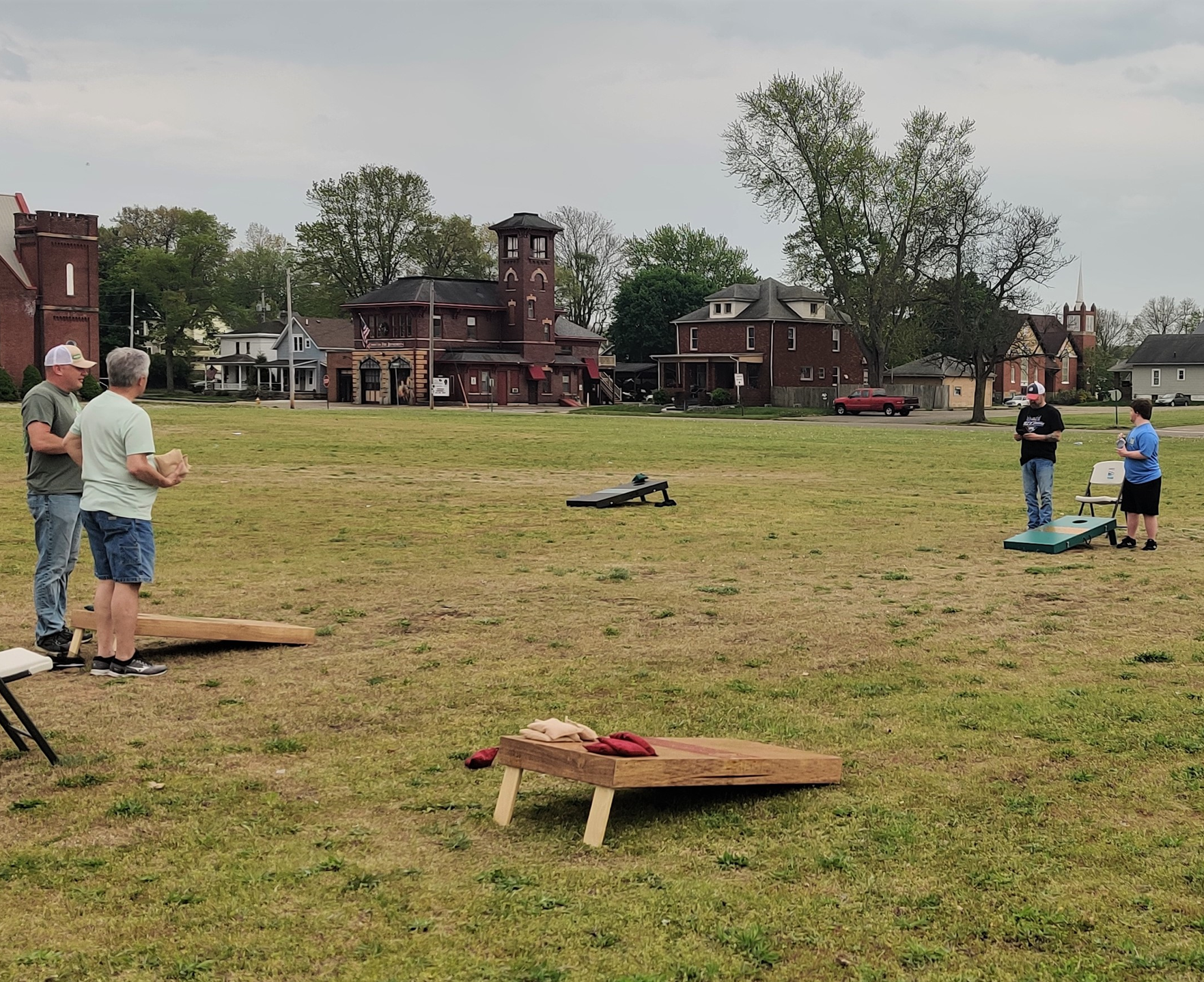 cornhole boards & people playing