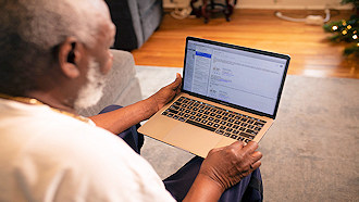 older man with laptop