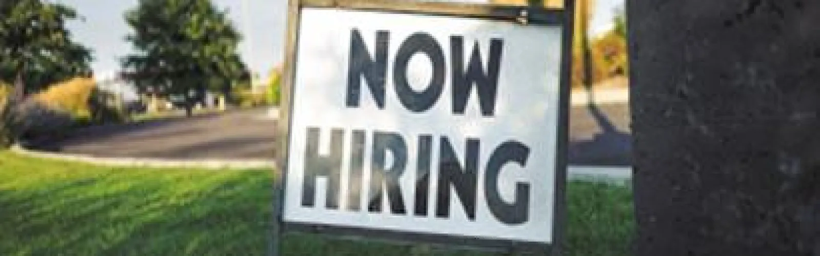 "Now Hiring" sign